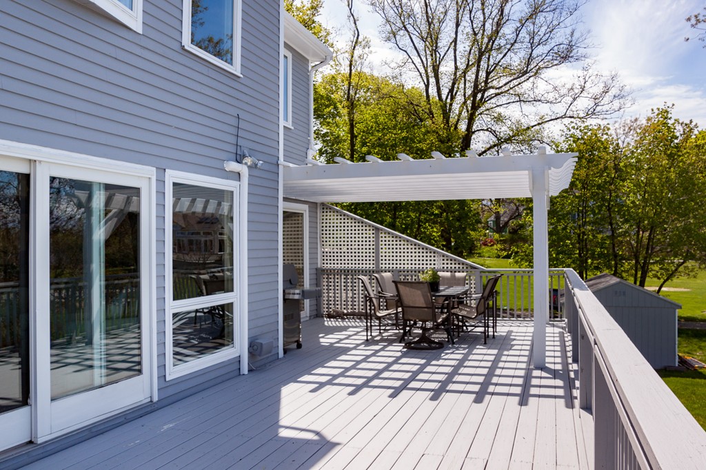 685 Jerusalem Road Cohasset, MA 02025 - Photo 11 of 29 a view of house with deck outdoor seating and wooden floor