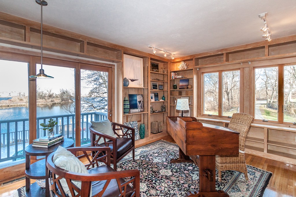 685 Jerusalem Road Cohasset, MA 02025 - Photo 16 of 29 a living room with furniture and a floor to ceiling window