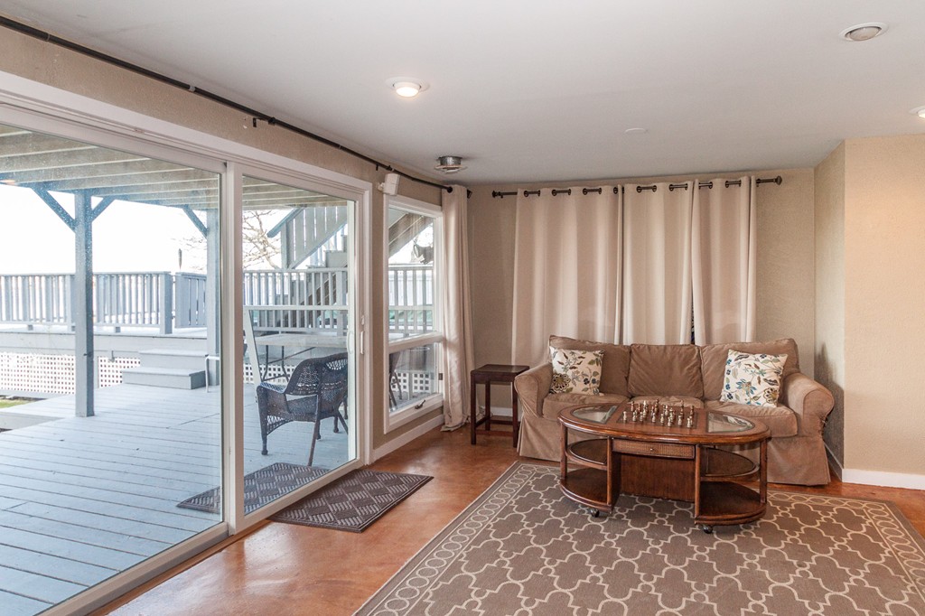 685 Jerusalem Road Cohasset, MA 02025 - Photo 26 of 29 a living room with furniture and a floor to ceiling window