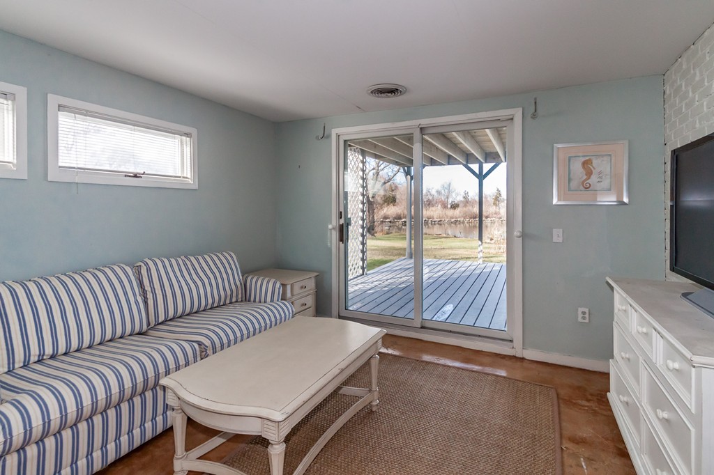 685 Jerusalem Road Cohasset, MA 02025 - Photo 28 of 29 a living room with furniture and a flat screen tv