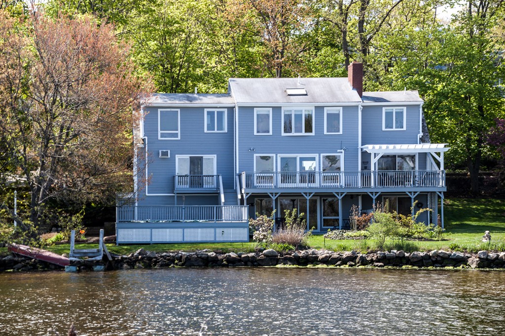 685 Jerusalem Road Cohasset, MA 02025 - Photo 29 of 29 a front view of a house with a yard and lake view
