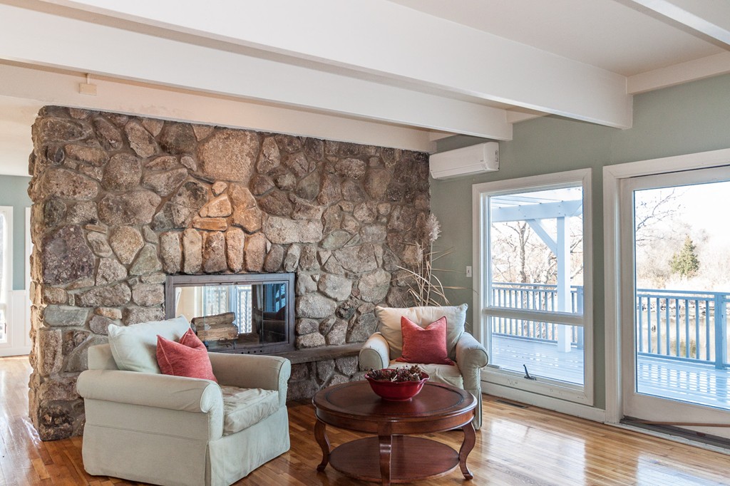 685 Jerusalem Road Cohasset, MA 02025 - Photo 9 of 29 a living room with furniture and a fireplace