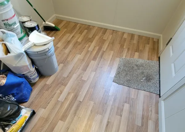 a kitchen with a stove and a granite wooden floor