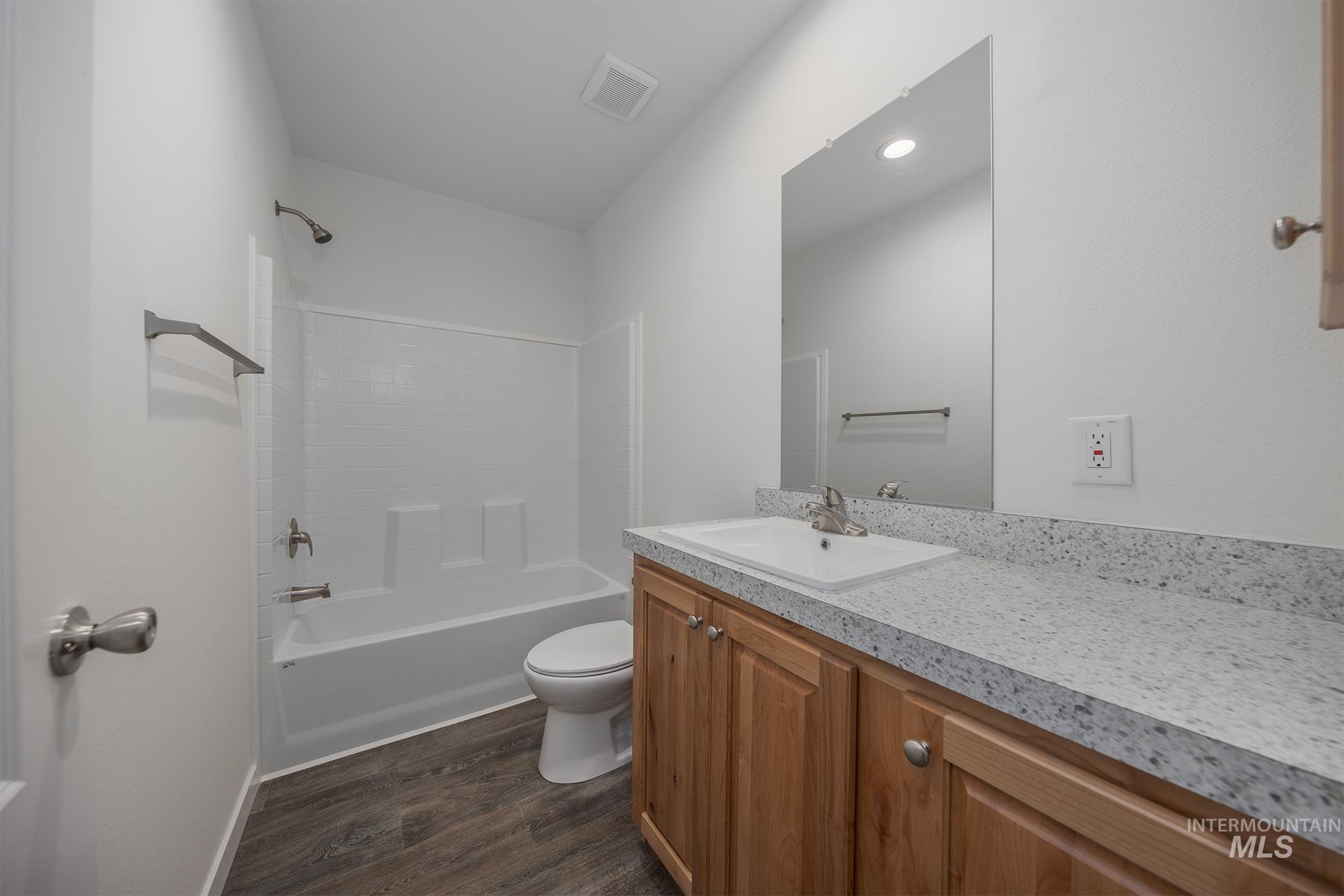 2750 Alden Road, Unit 8 8 Fruitland, ID 83619 - Photo 18 of 31 Bathroom with vanity, shower / tub combination, and dark wood finished floors