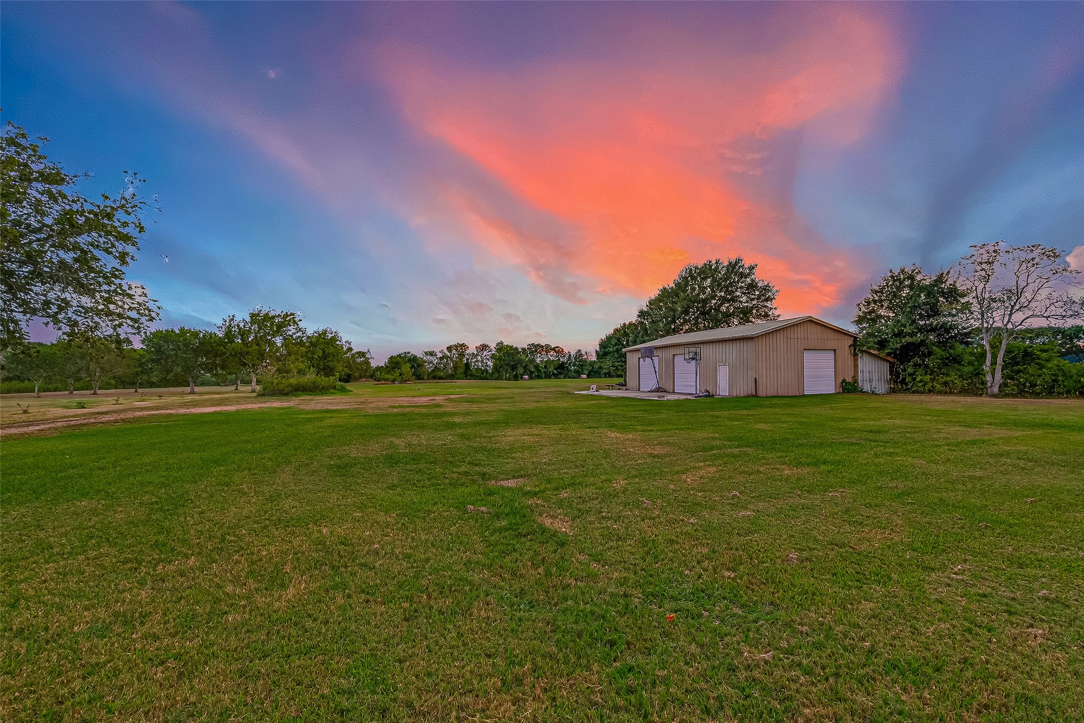 3122 Kueck Road Rosenberg, TX 77471 - Photo 23 of 25 a view of a green field with house in the background