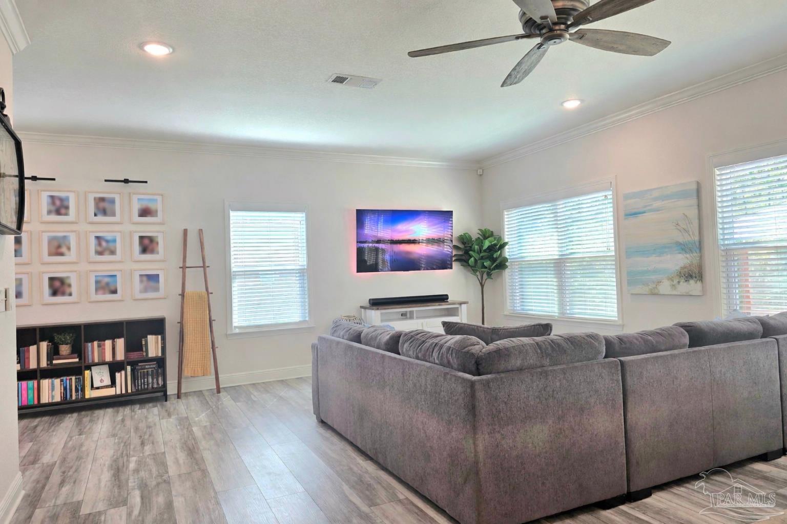 1307 Heron Inlet Pensacola, FL 32506 - Photo 12 of 35 a living room with furniture and a flat screen tv