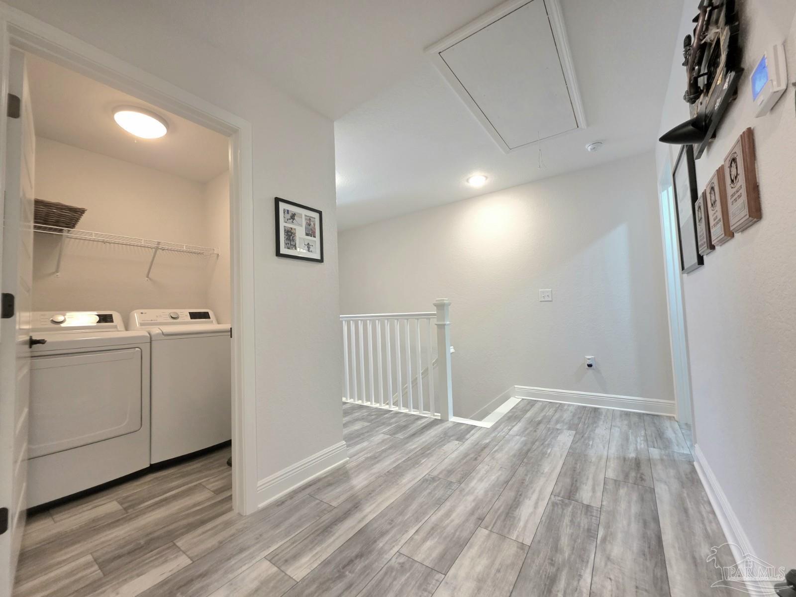 1307 Heron Inlet Pensacola, FL 32506 - Photo 19 of 35 a view of hallway with washer and dryer