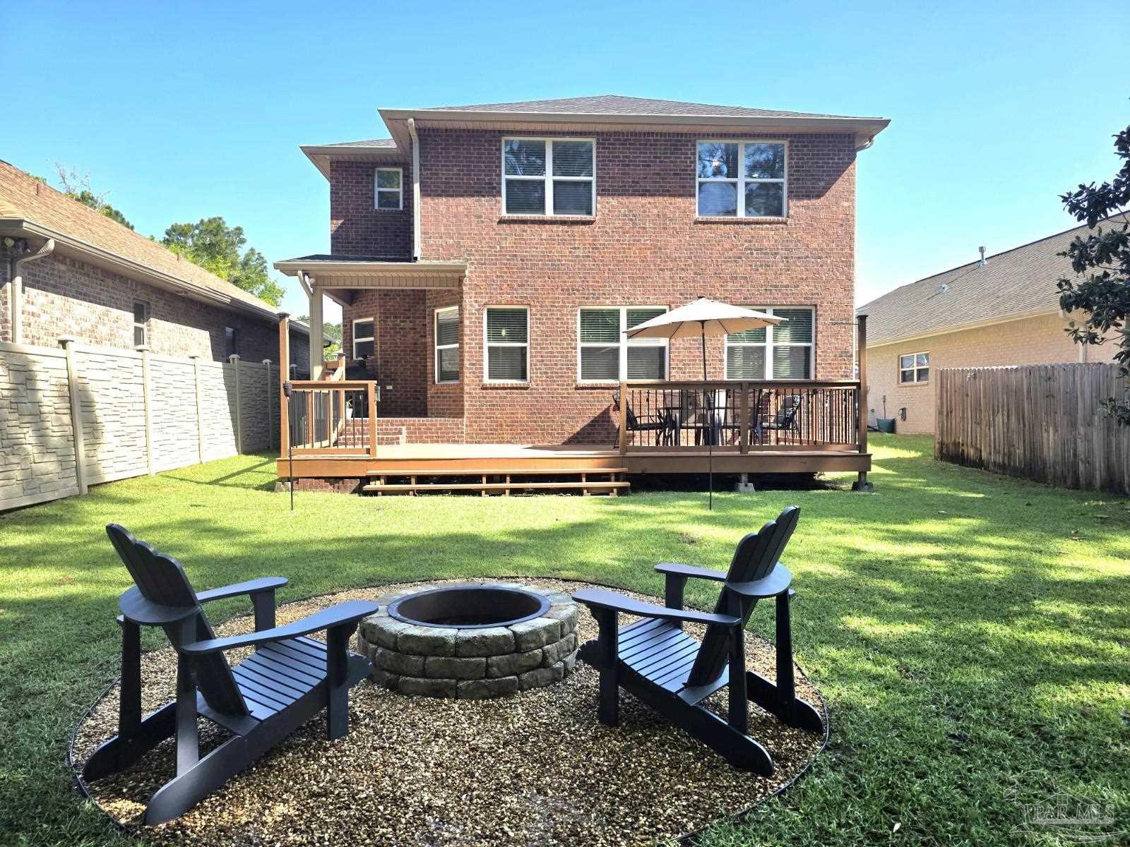 1307 Heron Inlet Pensacola, FL 32506 - Photo 2 of 35 a view of a house with backyard sitting area and garden