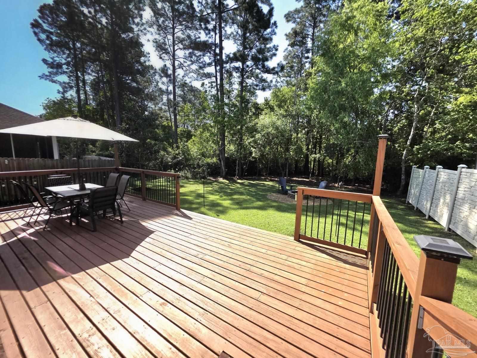 1307 Heron Inlet Pensacola, FL 32506 - Photo 28 of 35 a view of backyard with sitting area and wooden floor