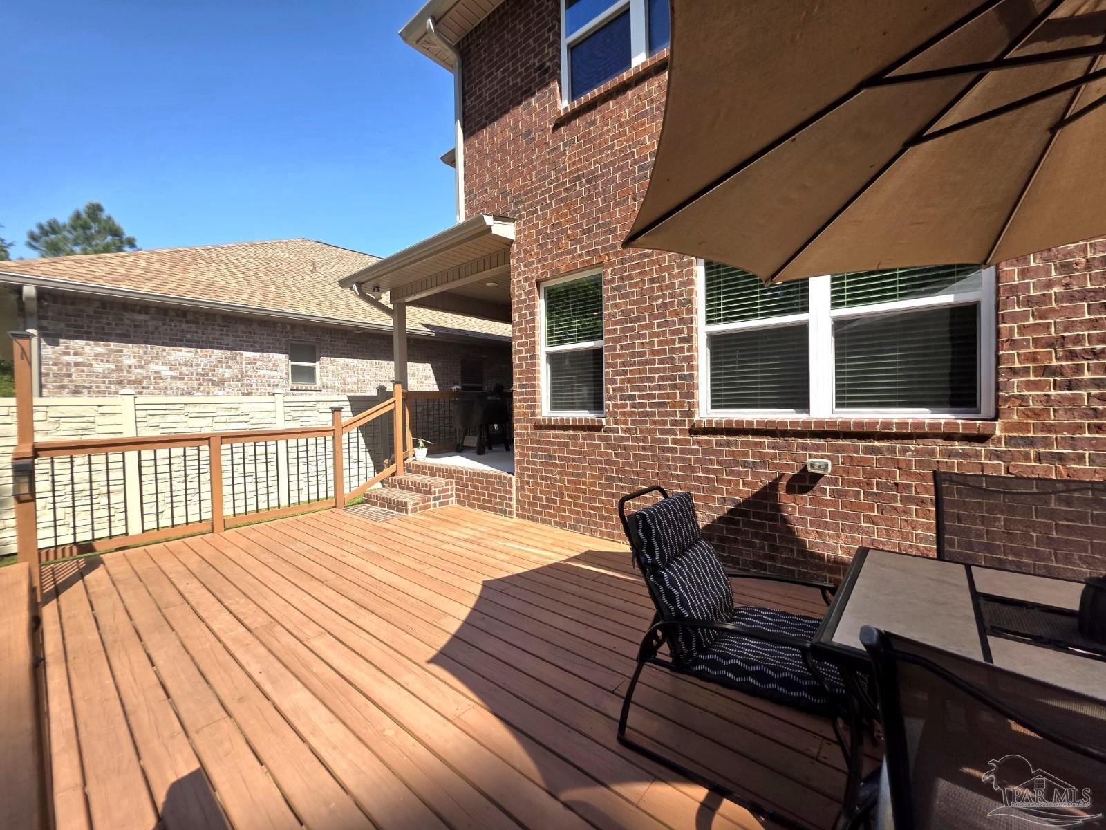 1307 Heron Inlet Pensacola, FL 32506 - Photo 29 of 35 a backyard of a house with table and chairs