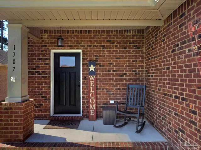 a front view of a house with stairs