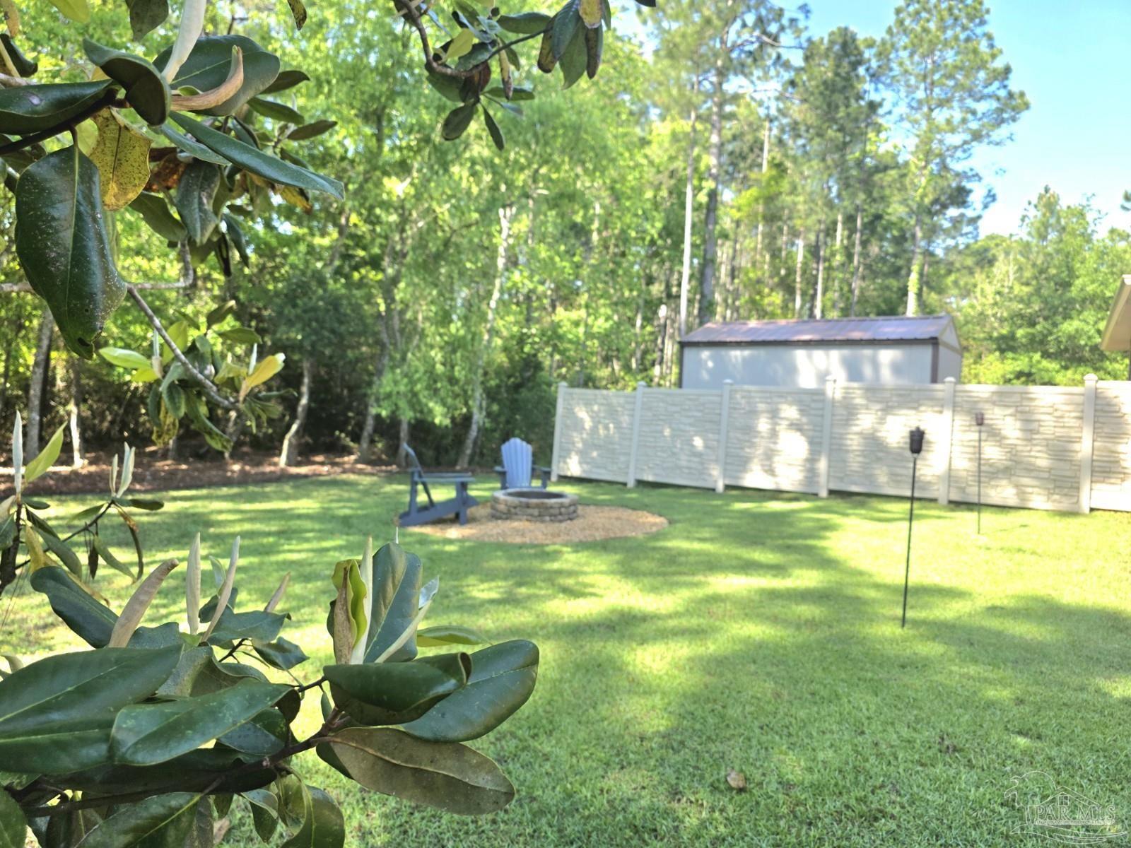 1307 Heron Inlet Pensacola, FL 32506 - Photo 31 of 35 a view of a backyard with a slide