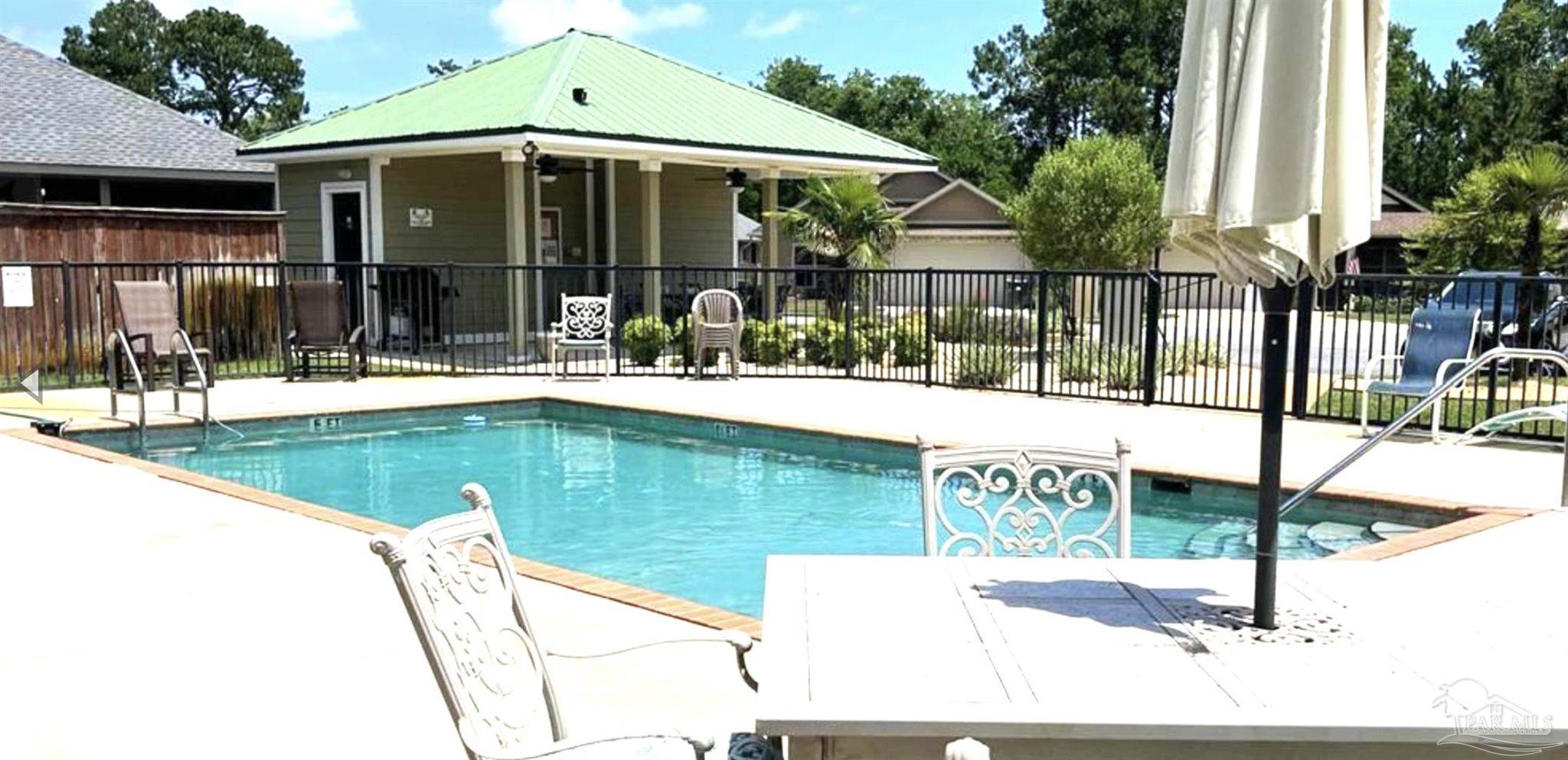 1307 Heron Inlet Pensacola, FL 32506 - Photo 33 of 35 a swimming pool view with a outdoor seating