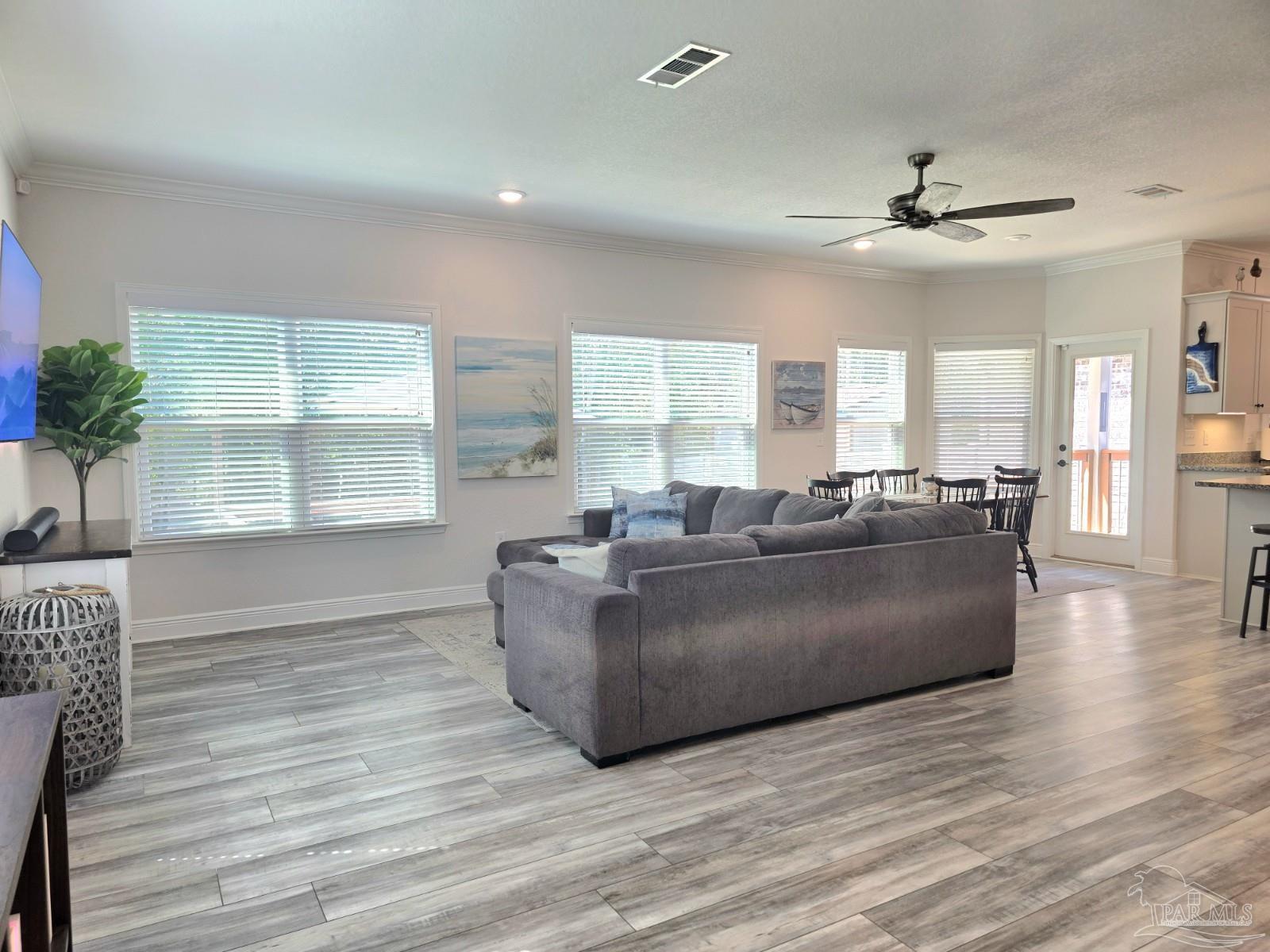 1307 Heron Inlet Pensacola, FL 32506 - Photo 9 of 35 a living room with furniture window and wooden floor