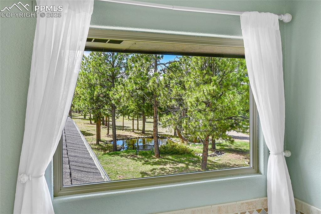 17350 Goshawk Road Colorado Springs, CO 80908 - Photo 22 of 50 a view of a backyard door