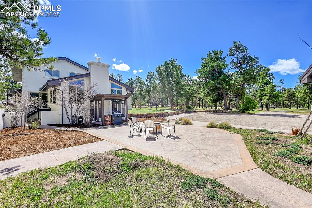 17350 Goshawk Road Colorado Springs, CO 80908 - Photo 37 of 50 a view of outdoor space yard and patio
