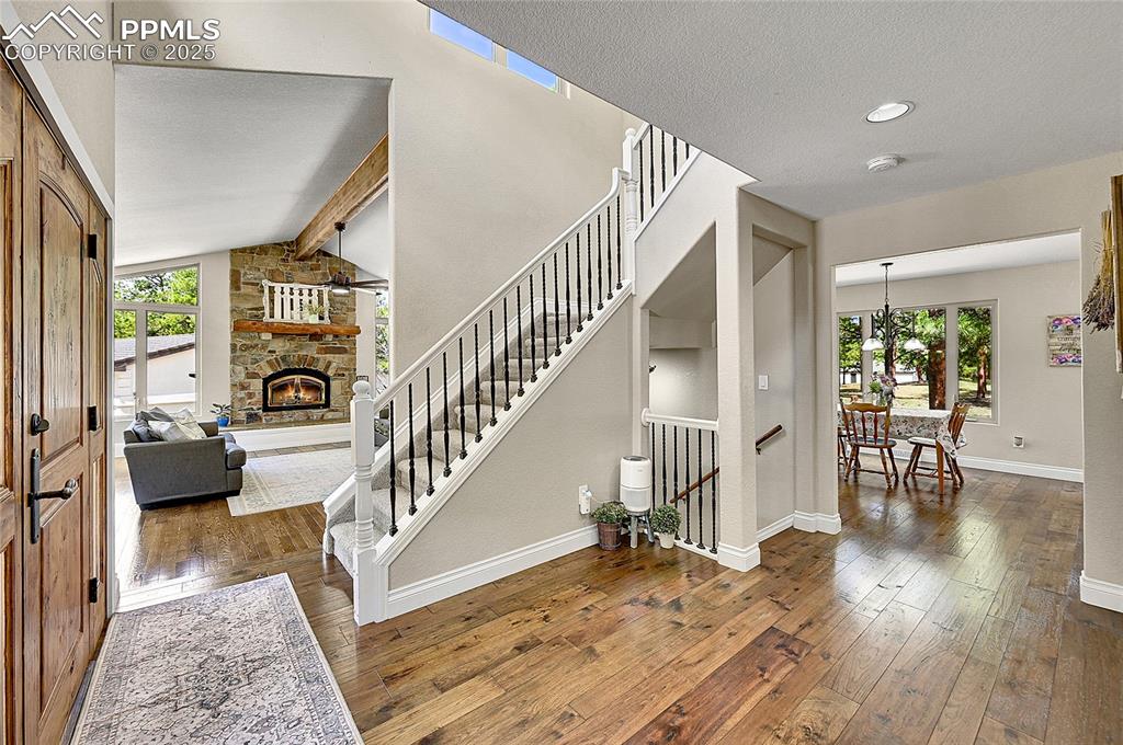 17350 Goshawk Road Colorado Springs, CO 80908 - Photo 6 of 50 a view of entryway and hall with wooden floor