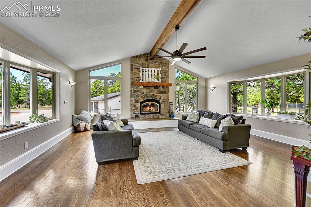17350 Goshawk Road Colorado Springs, CO 80908 - Photo 9 of 50 a living room with furniture and a large window