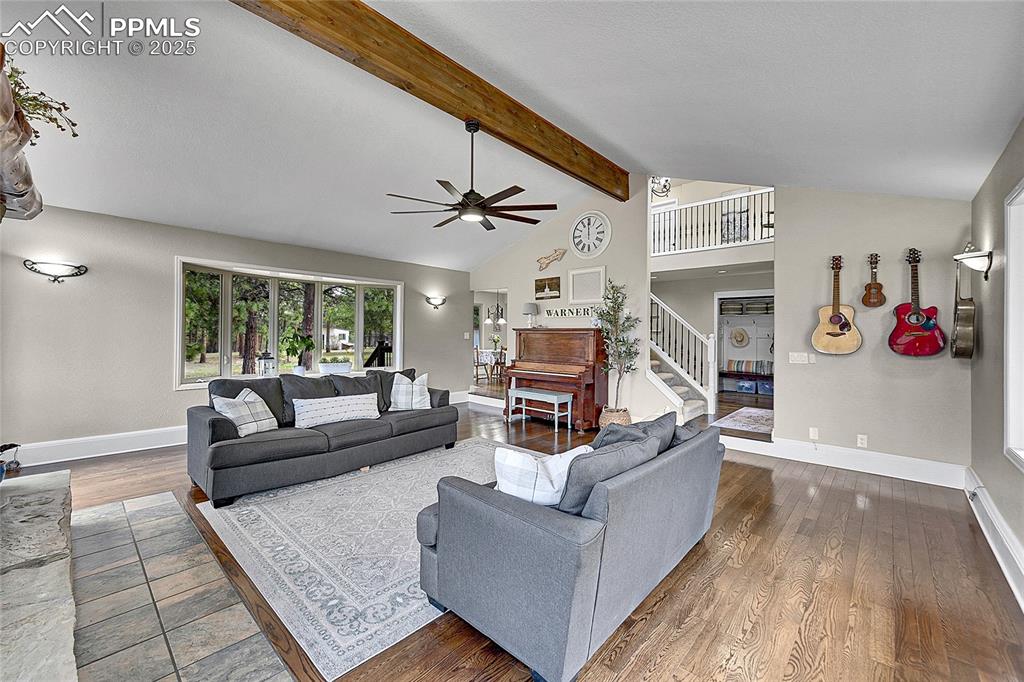 17350 Goshawk Road Colorado Springs, CO 80908 - Photo 10 of 50 a living room with furniture and a wooden floor