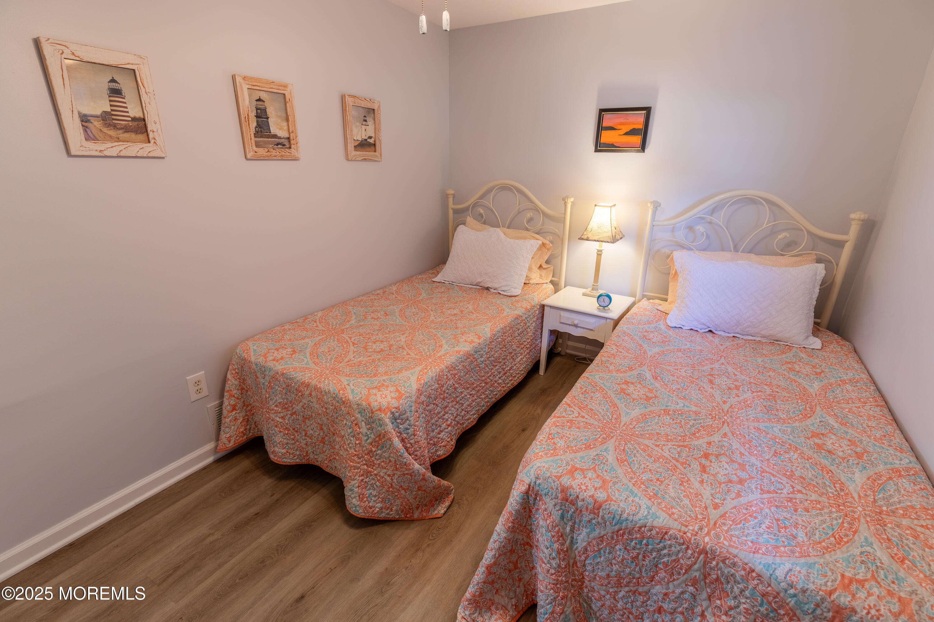 121 L Street Seaside Park, NJ 08752 - Photo 17 of 37 a bedroom with a bed and wooden floor