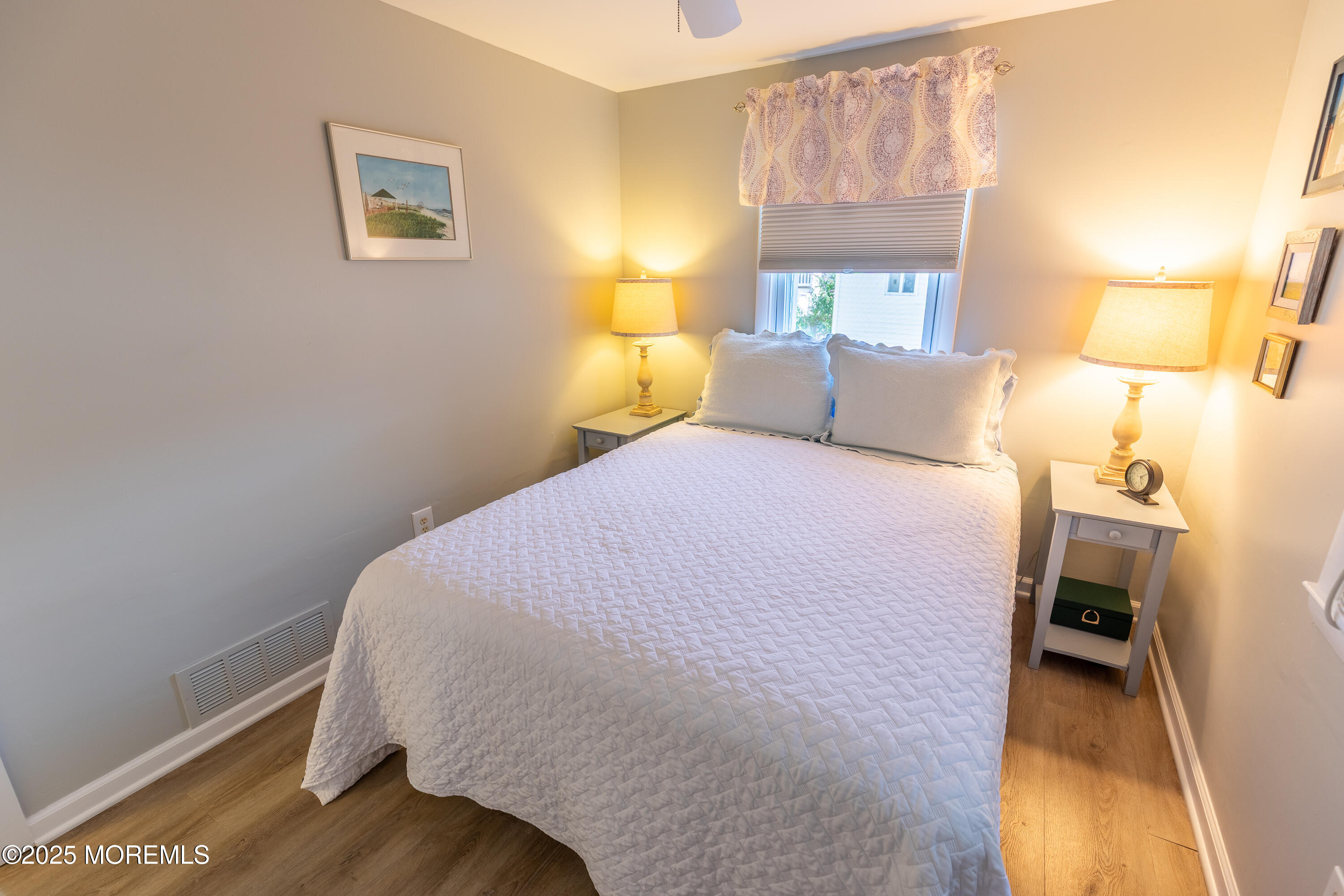 121 L Street Seaside Park, NJ 08752 - Photo 18 of 37 a bed room with a bed and a lamp