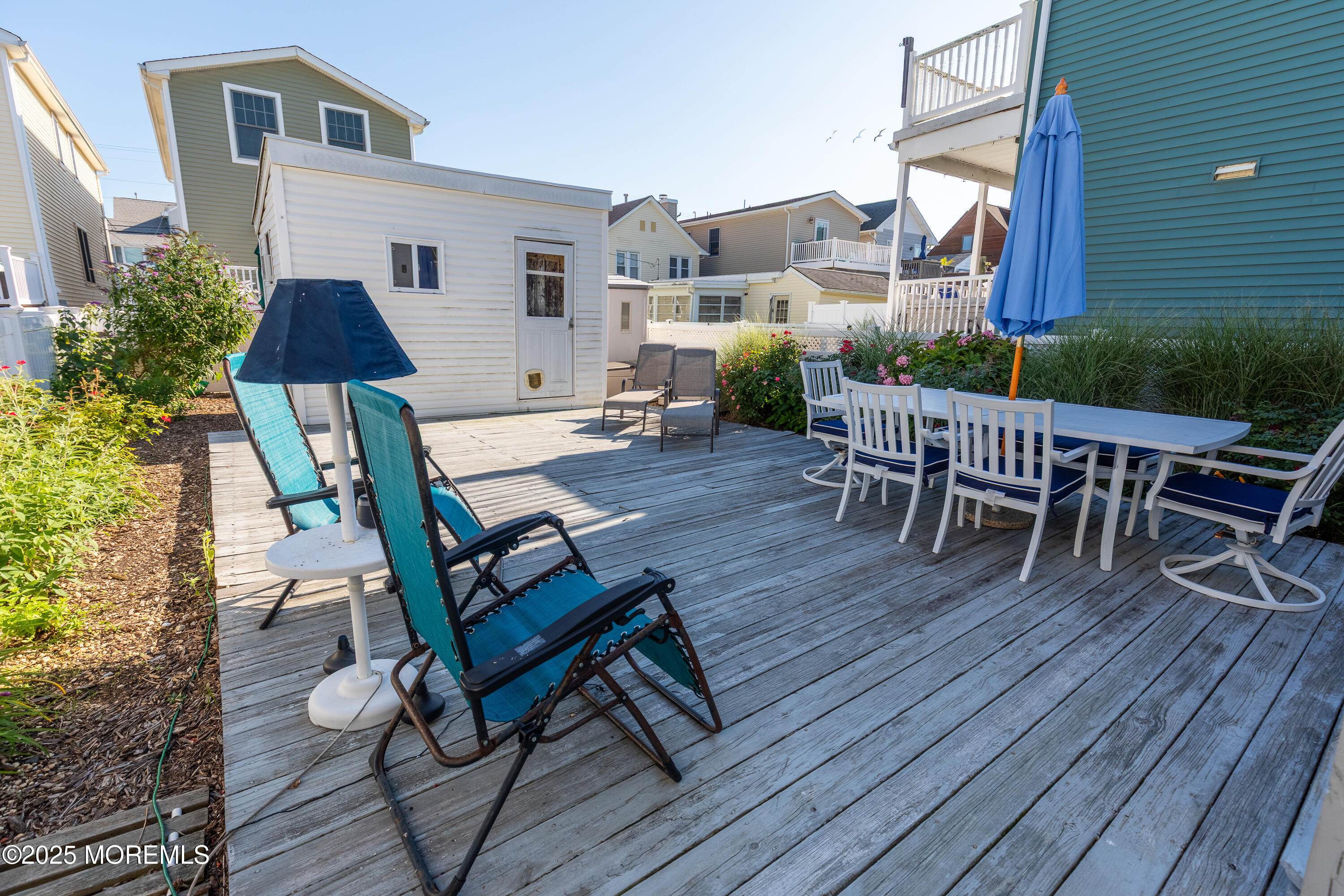 121 L Street Seaside Park, NJ 08752 - Photo 27 of 37 a outdoor space with chairs and wooden floor