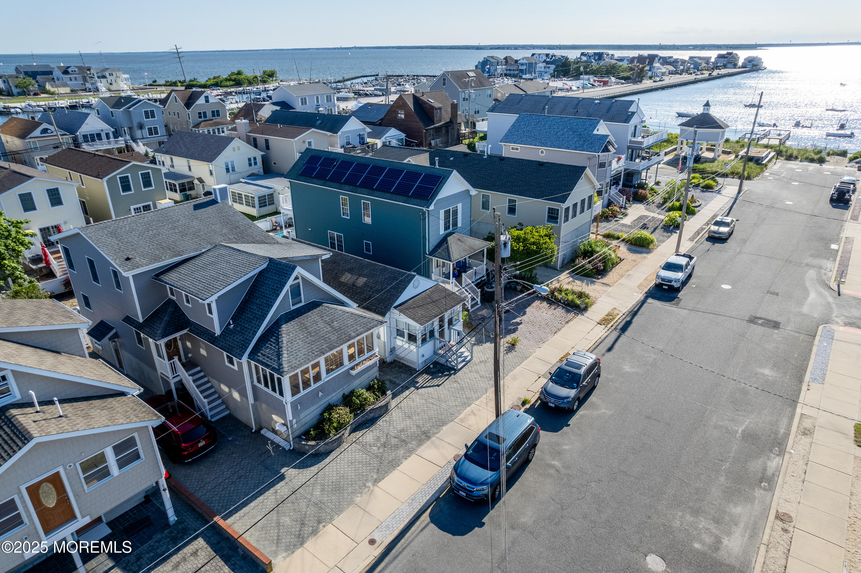 121 L Street Seaside Park, NJ 08752 - Photo 31 of 37 an aerial view of a house with a yard patio and lake view