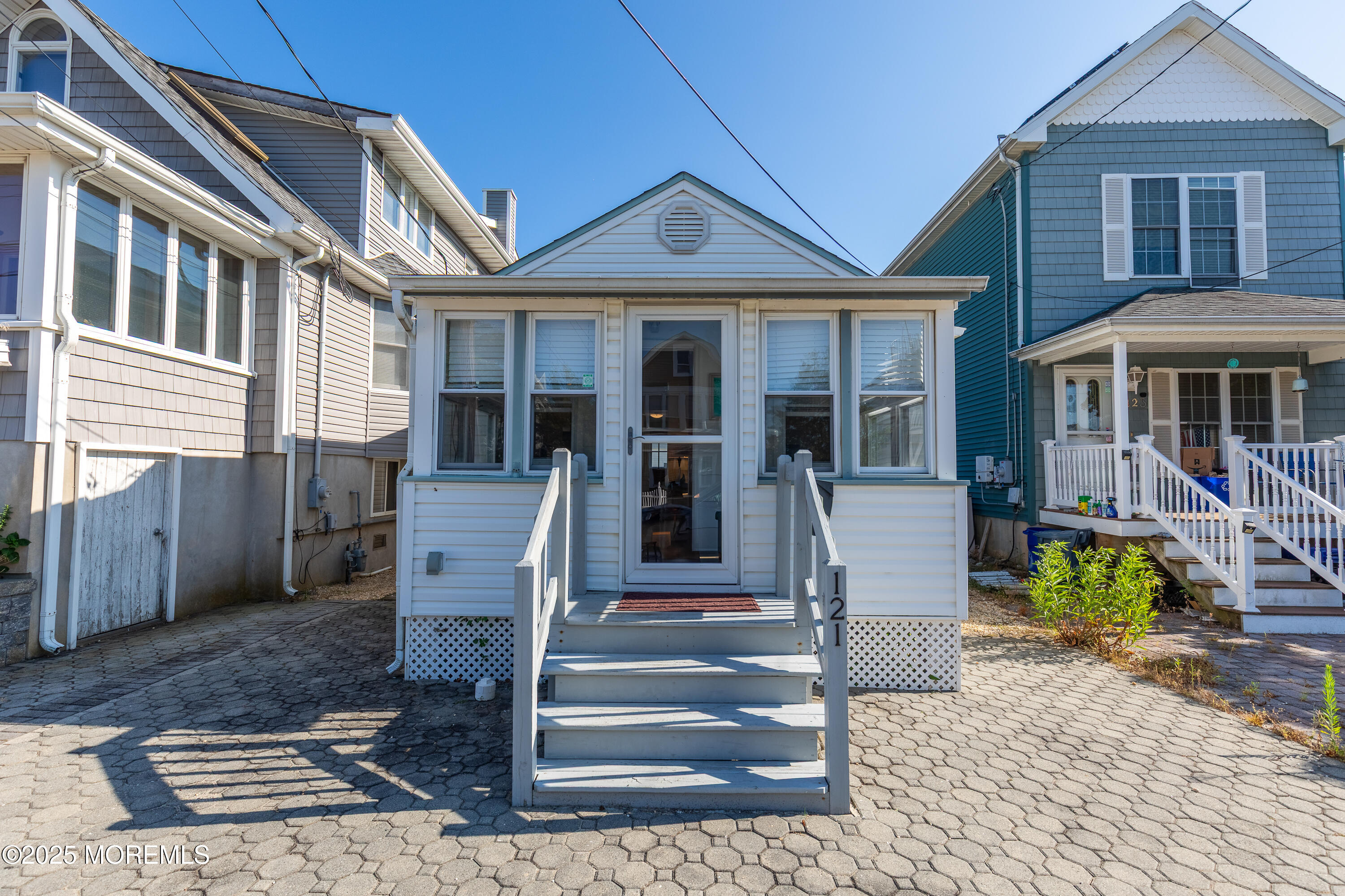 121 L Street Seaside Park, NJ 08752 - Photo 35 of 37 a front view of a house with a porch