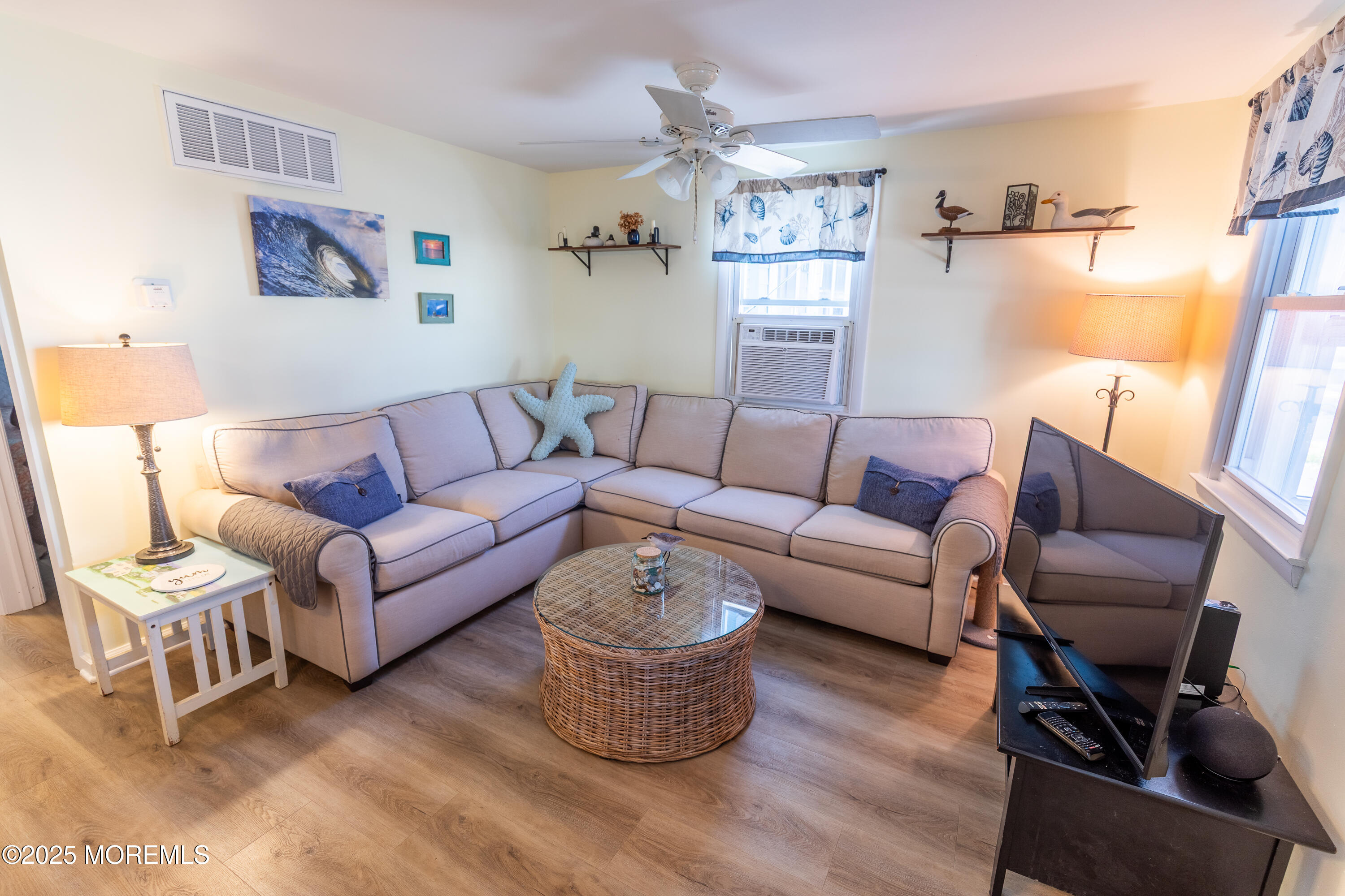 121 L Street Seaside Park, NJ 08752 - Photo 8 of 37 a living room with furniture and a flat screen tv