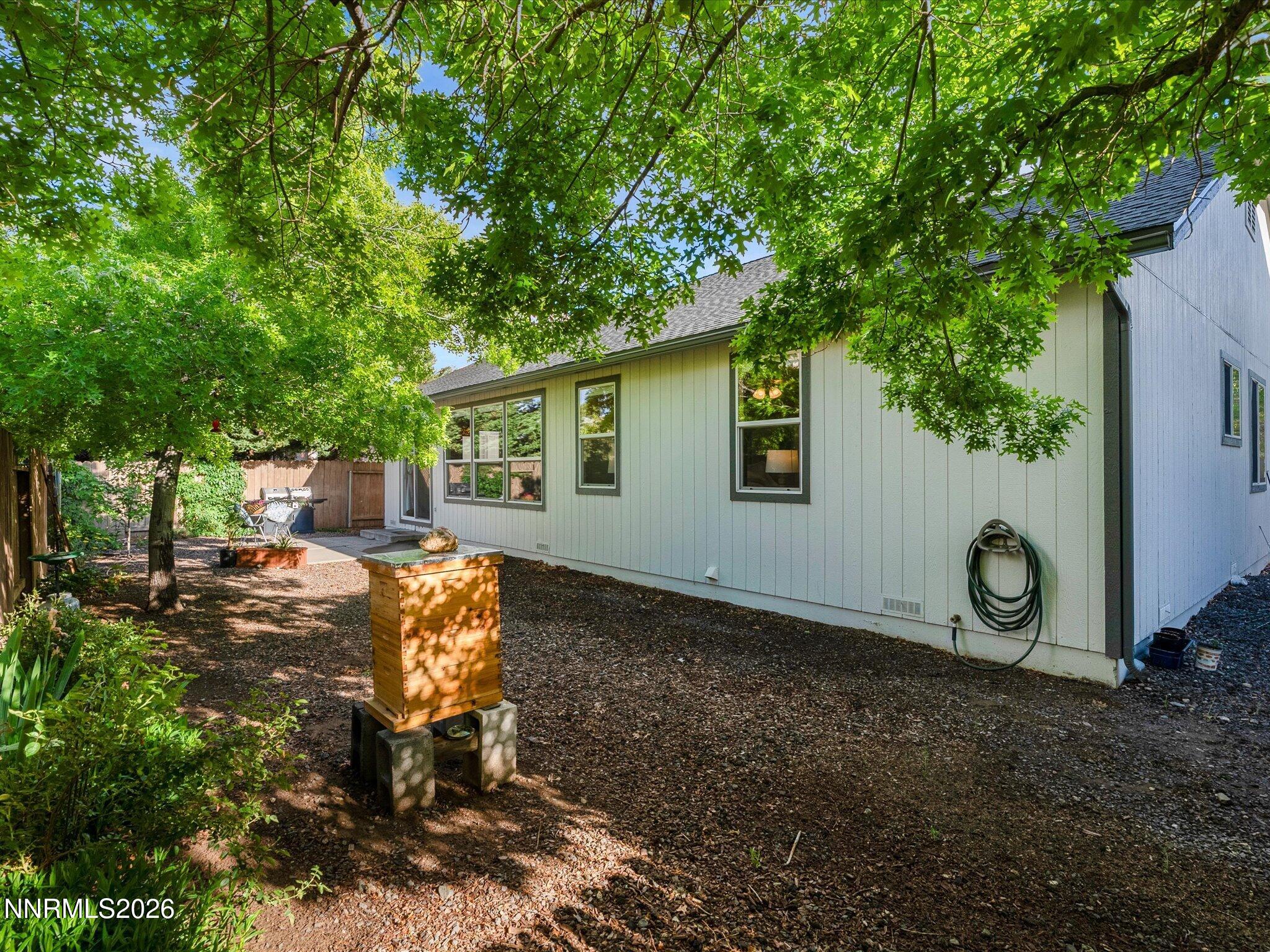 3101 Green River Drive Reno, NV 89503 - Photo 45 of 62 a backyard of a house with barbeque oven table and chairs