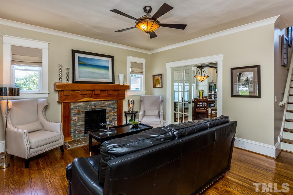 514 East Whitaker Mill Road Raleigh, NC 27608 - Photo 3 of 25 a living room with furniture and a fireplace