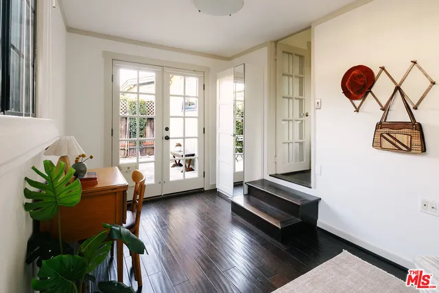 a view of room with window and wooden floor