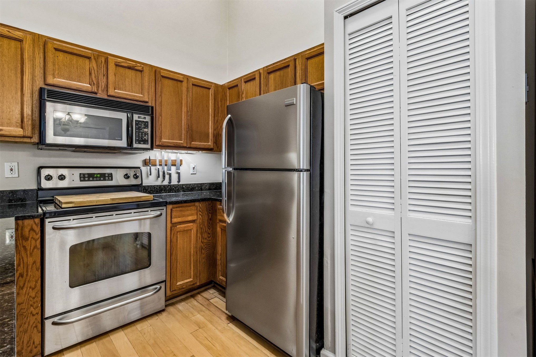 1601 Nectarine Street, Unit A6 Fernandina Beach, FL 32034 - Photo 15 of 40 a white refrigerator freezer and a stove sitting inside of a kitchen