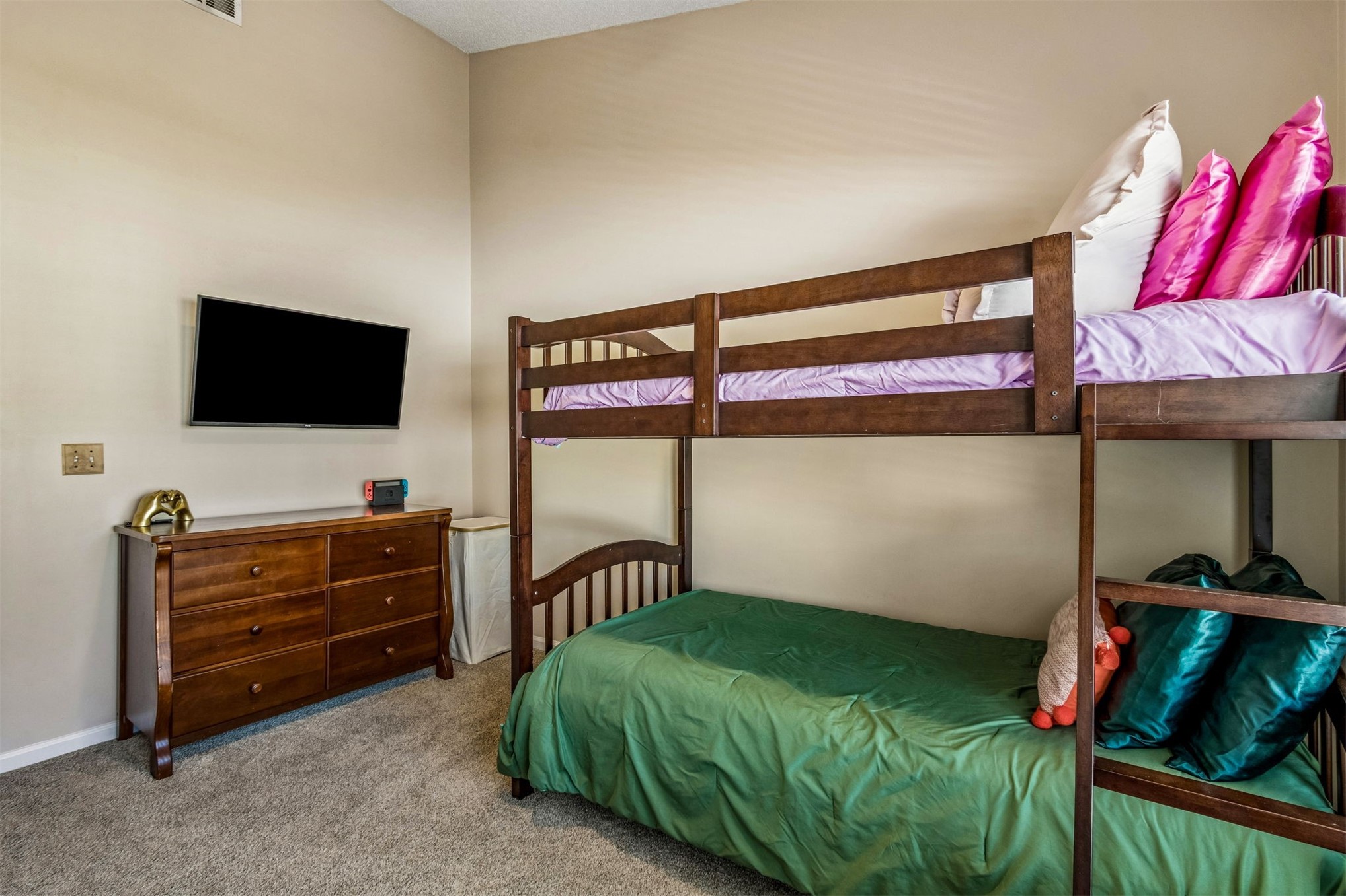 1601 Nectarine Street, Unit A6 Fernandina Beach, FL 32034 - Photo 23 of 40 a bedroom with a bed and a flat screen tv