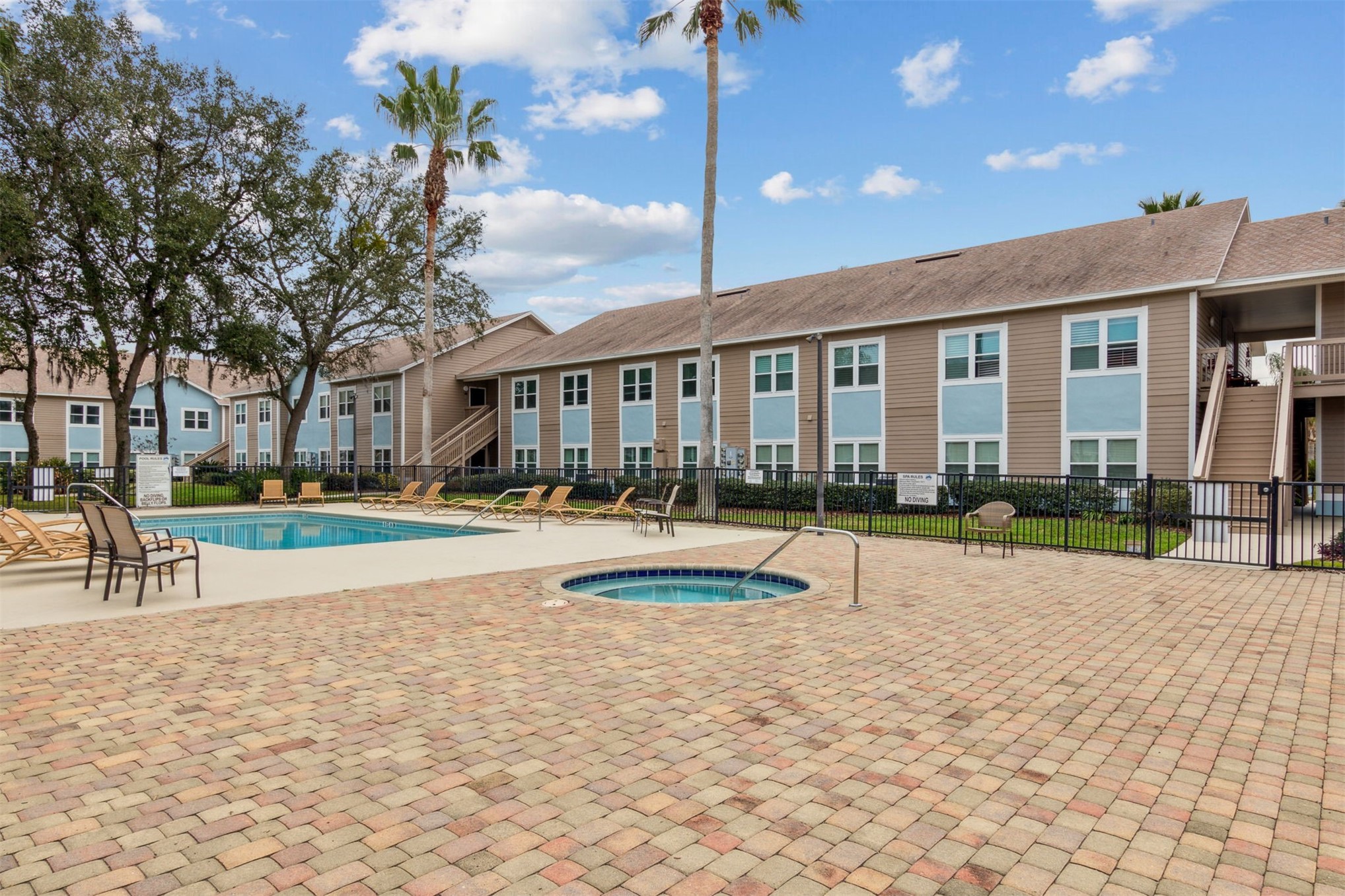 1601 Nectarine Street, Unit A6 Fernandina Beach, FL 32034 - Photo 30 of 40 a view of a house with swimming pool and sitting area