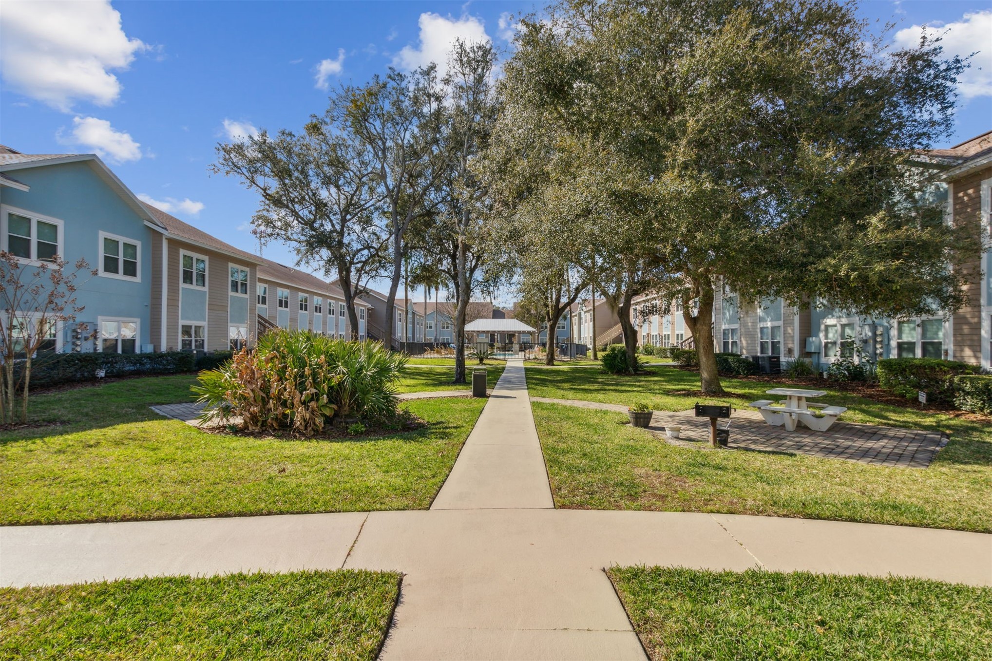 1601 Nectarine Street, Unit A6 Fernandina Beach, FL 32034 - Photo 36 of 40 a view of a house with garden and trees