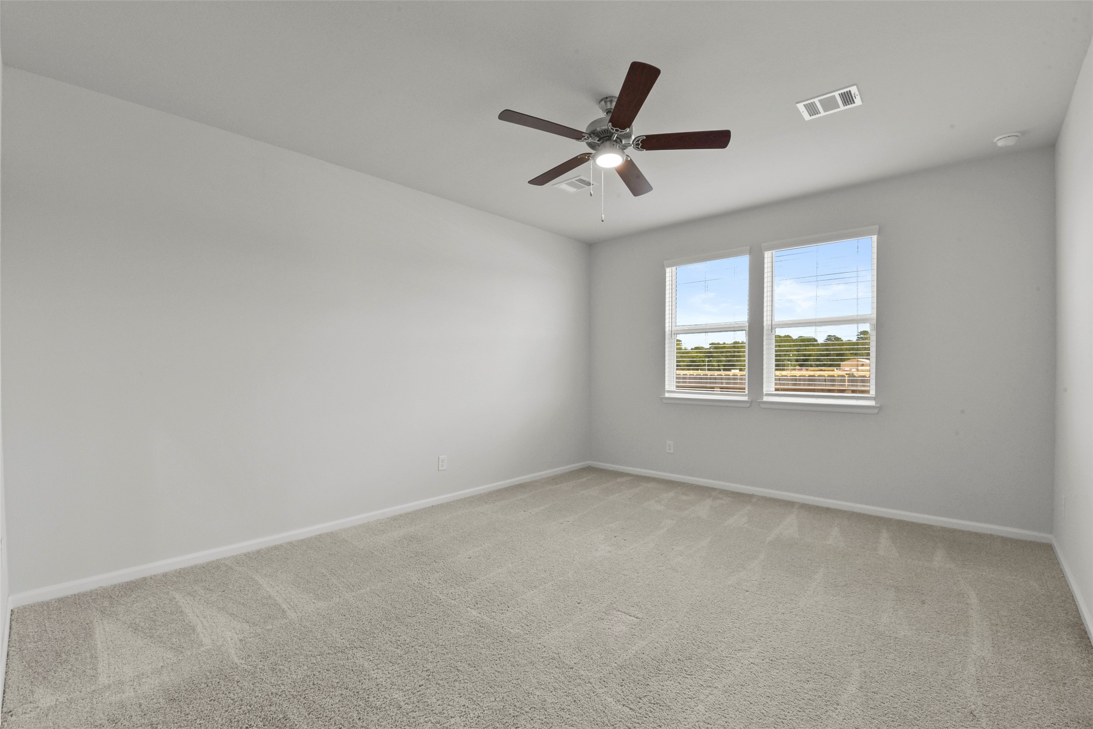 20811 Adventure Way Porter, TX 77365 - Photo 20 of 28 a view of a big room with wooden floor and windows