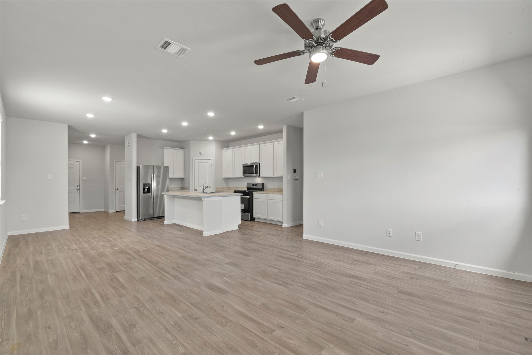 20811 Adventure Way Porter, TX 77365 - Photo 4 of 28 a view of an empty room with wooden floor