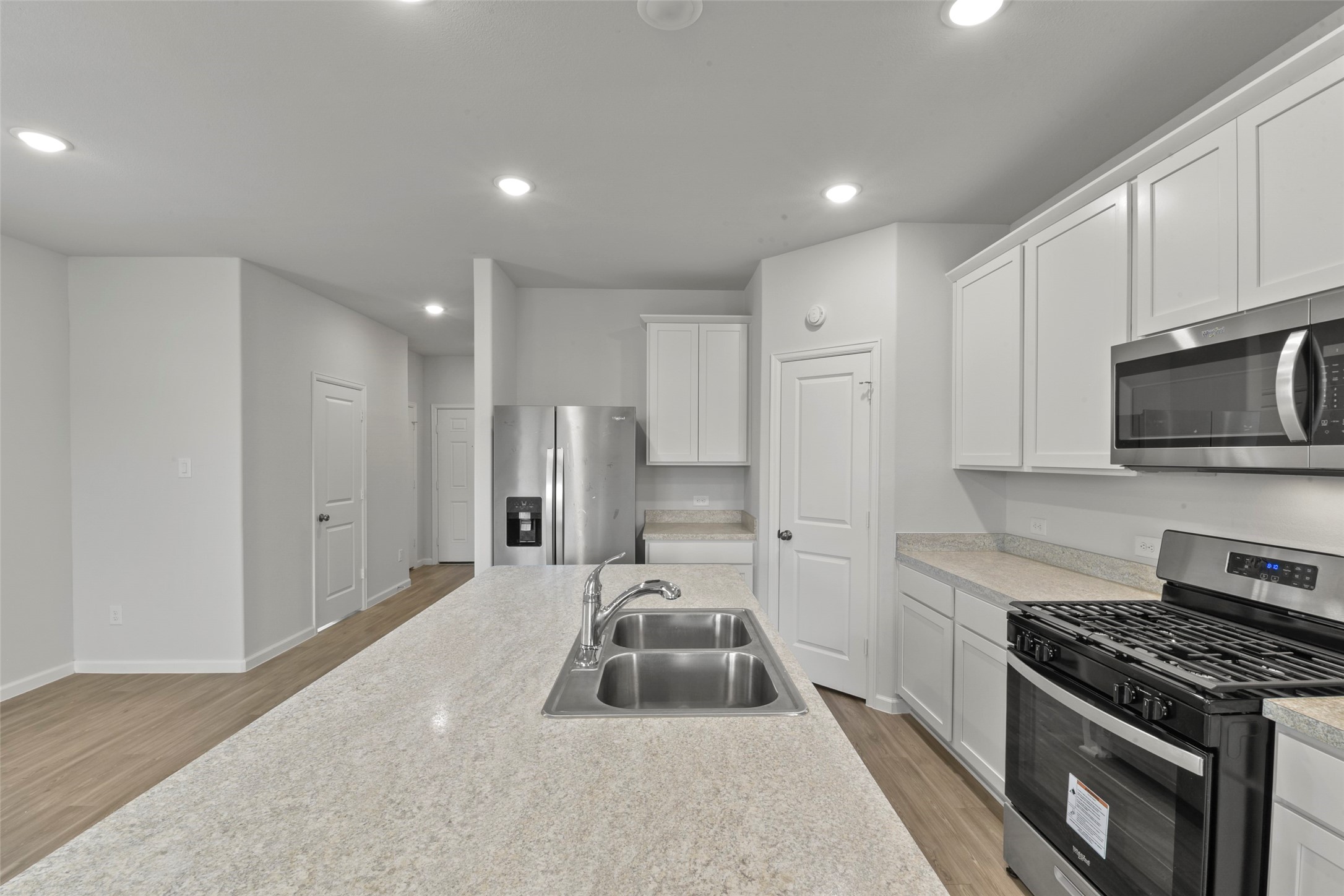 20811 Adventure Way Porter, TX 77365 - Photo 9 of 28 a kitchen with sink stove and refrigerator