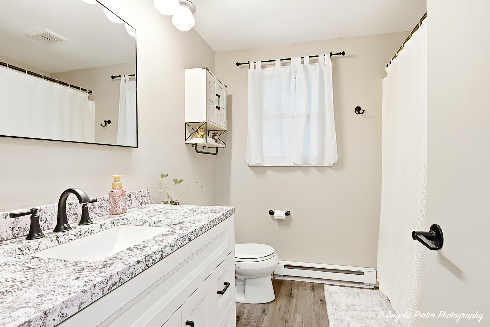 5703 Fox Lake Road McHenry, IL 60051 - Photo 13 of 20 a bathroom with a granite countertop sink toilet and mirror