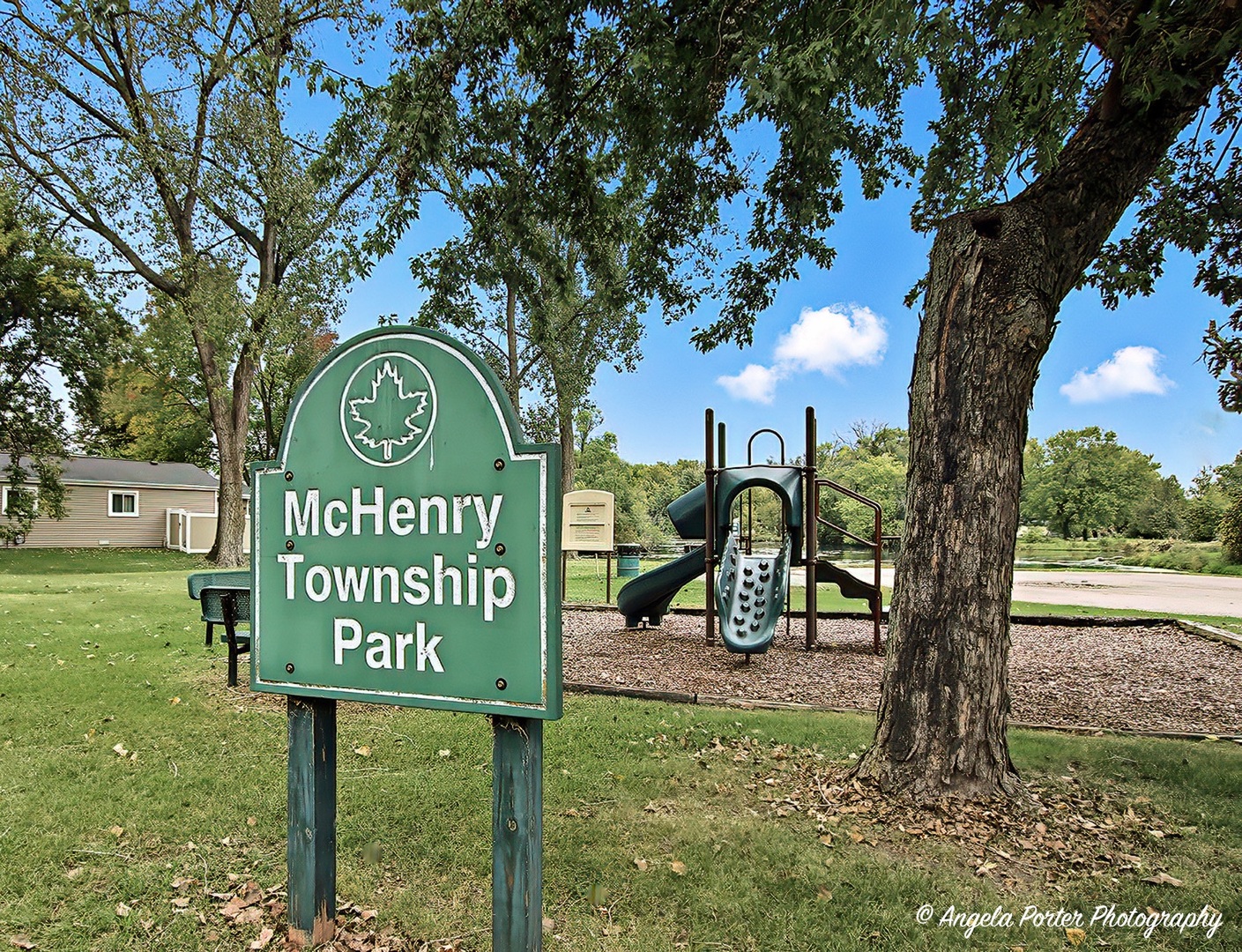 5703 Fox Lake Road McHenry, IL 60051 - Photo 17 of 20 a sign that is on a pole