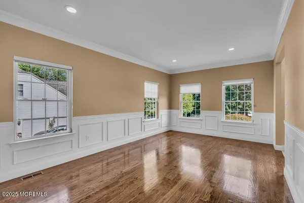 a large kitchen with a large counter top appliances and cabinets