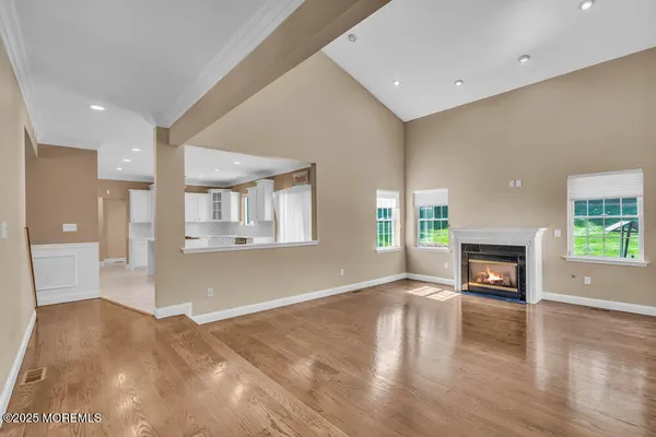 a kitchen with a sink a counter top space stainless steel appliances and cabinets