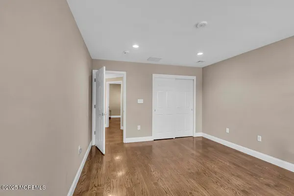a view of a livingroom with furniture and a ceiling fan