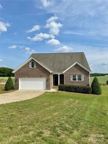 a front view of a house with yard