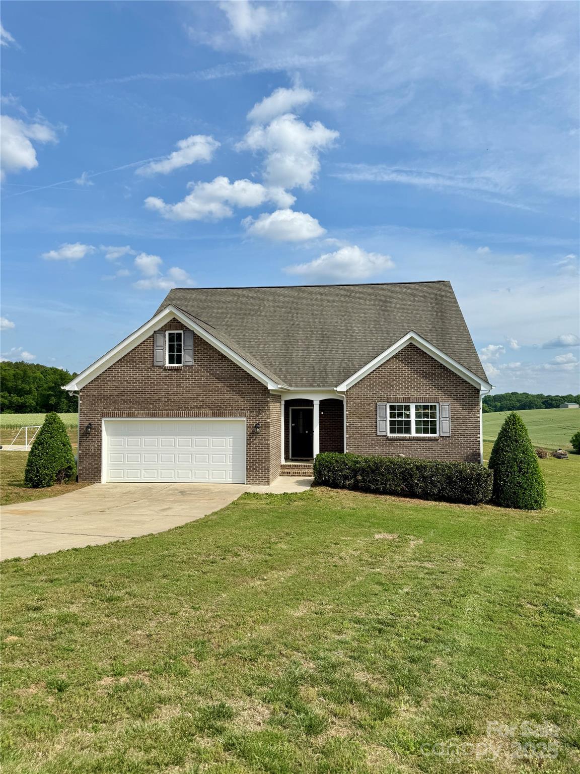 a front view of a house with yard
