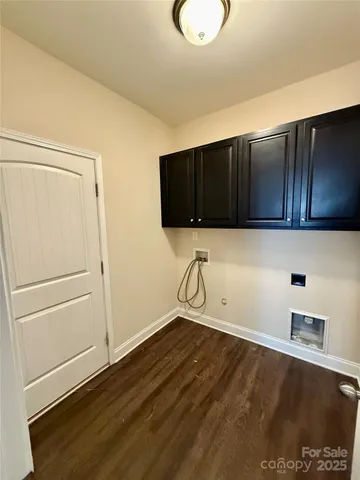 a view of a storage & utility room with wooden floor