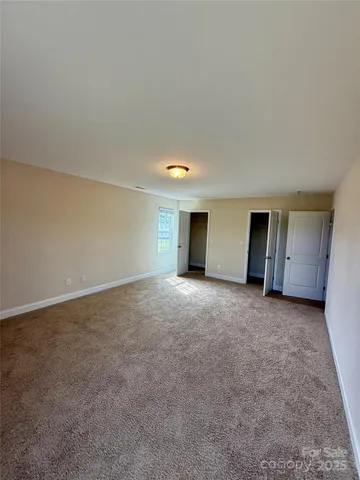 a view of a lake with boats and trees in the background