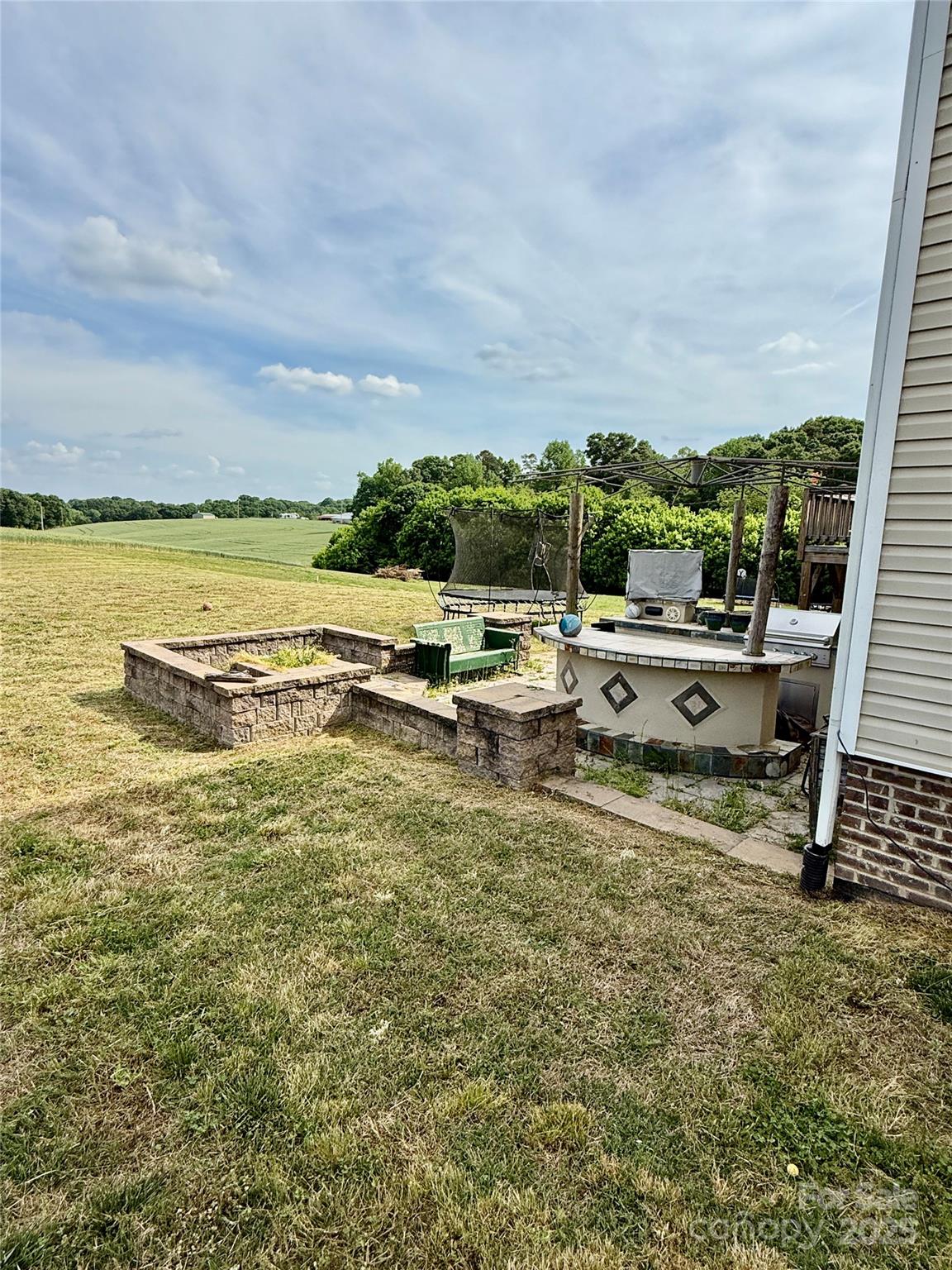 4048 Avis Way Monroe, NC 28110 - Photo 22 of 23 a view of a lake with boats and trees in the background