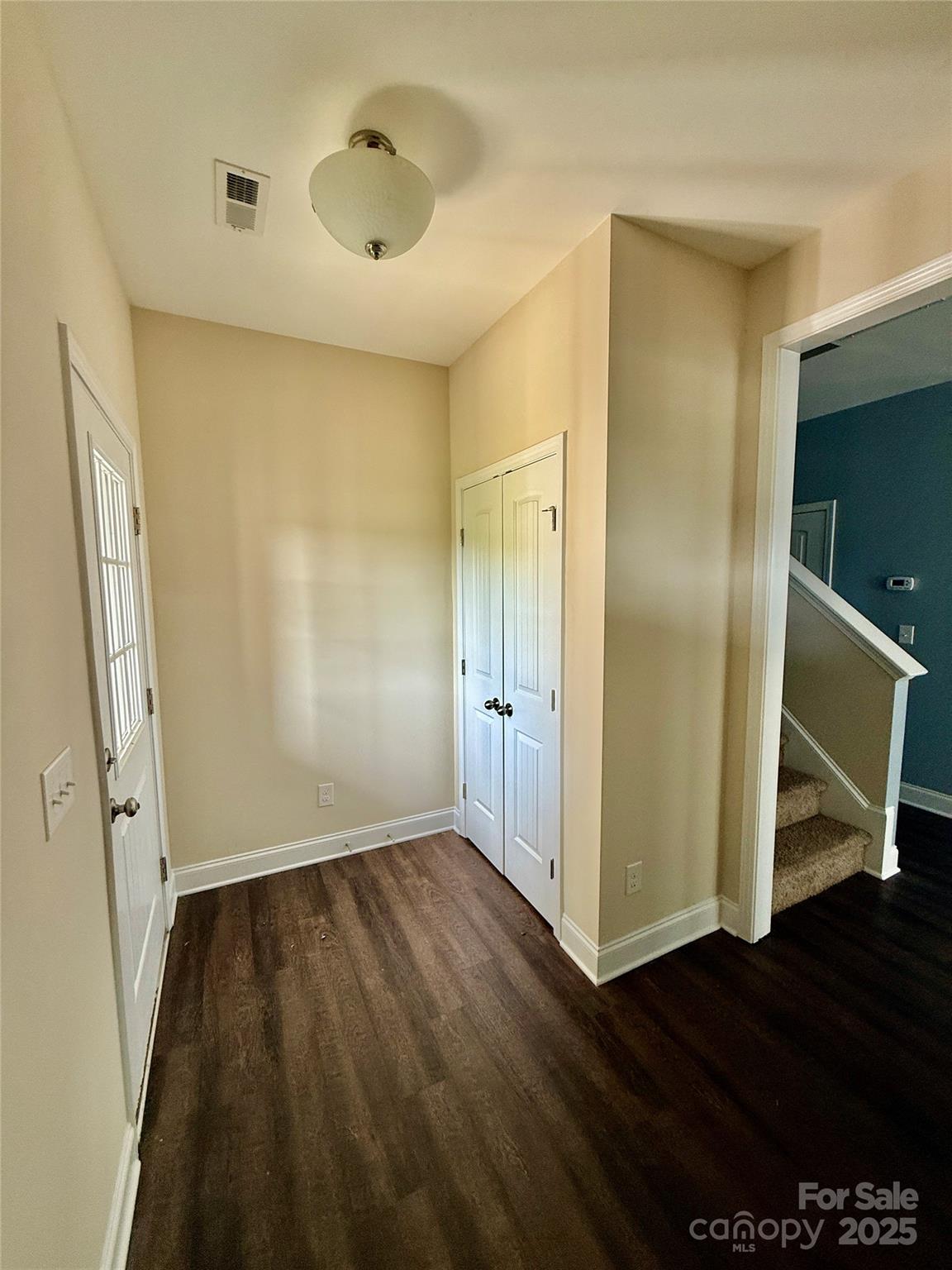 4048 Avis Way Monroe, NC 28110 - Photo 3 of 23 a view of an empty room with wooden floor and a window